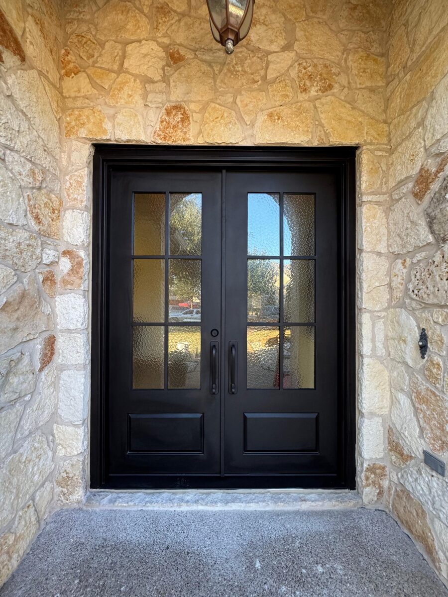Capitol Iron Doors — Classic double iron door installed in Texas stone home